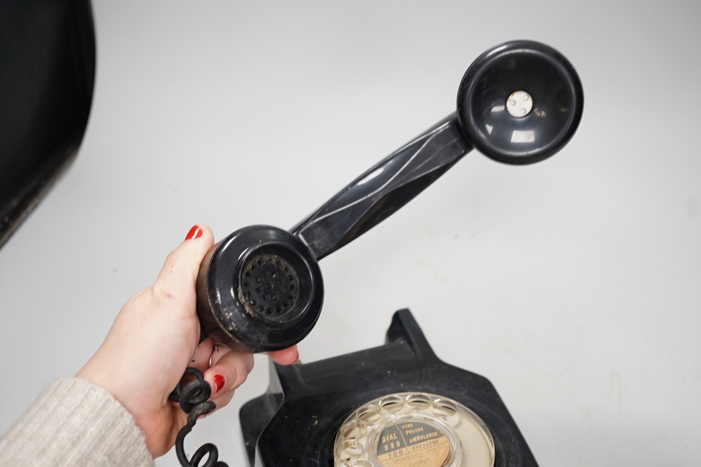 A black Bakelite telephone